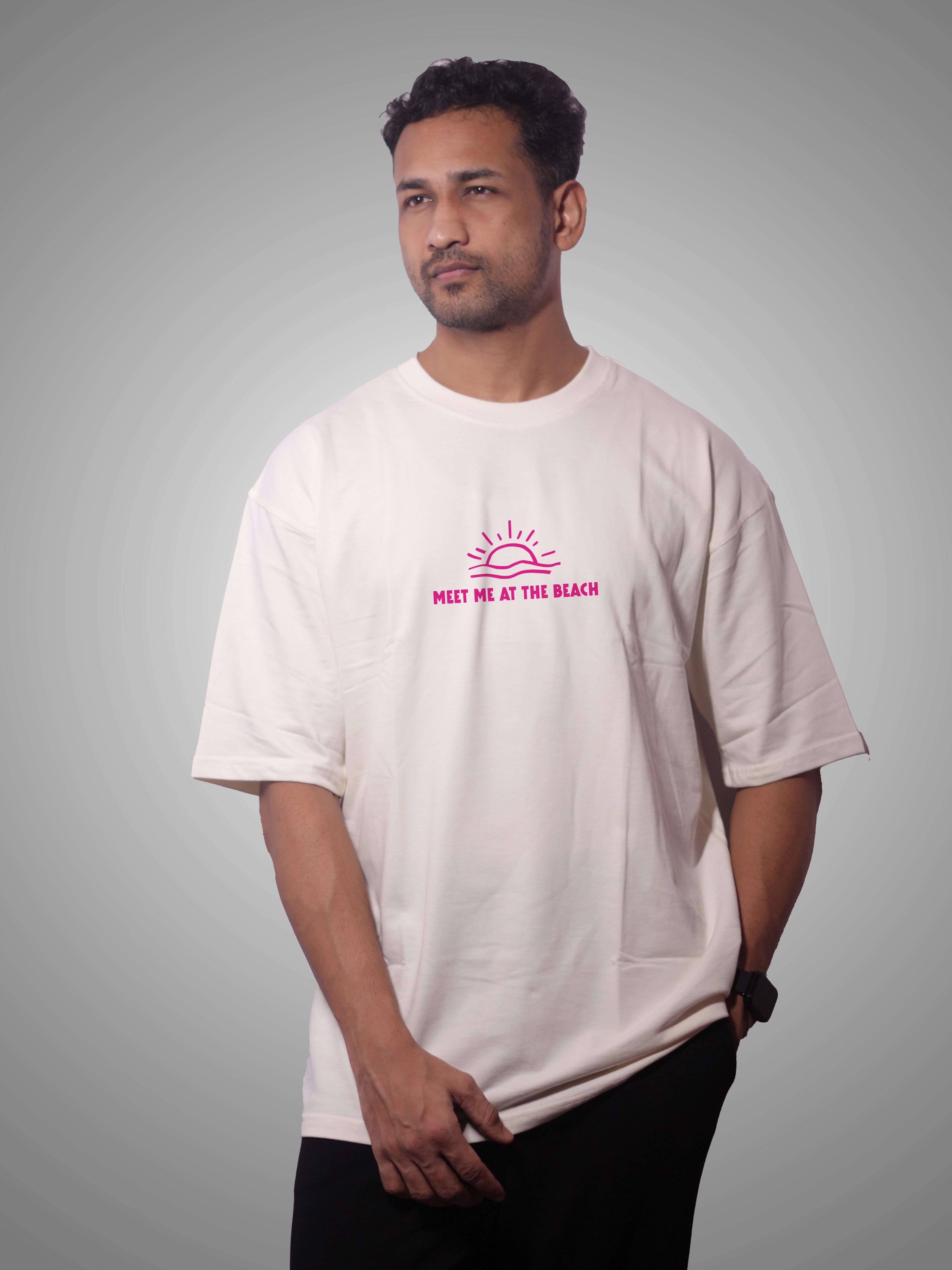 Man wearing a white t-shirt with pink text and logo on a gray background